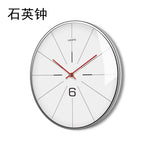 Horloge Murale "Zénith" – Design Nordique Suspendu en Métal Doré - Vignette | La Belle Horloge